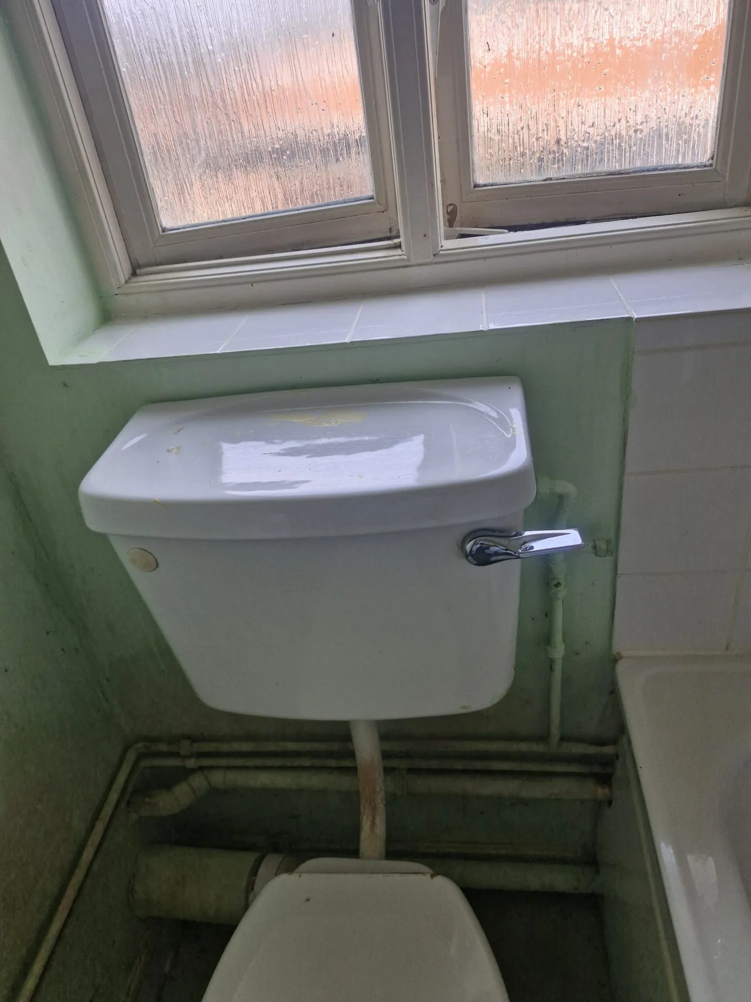 After specialist bathroom preparation: cleared toilet area in an occupied Colchester home